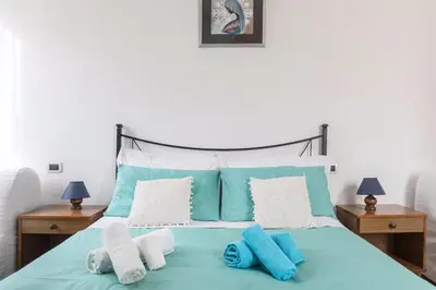 Letto o letti in una camera di CASA VACANZA LYUDMYLA