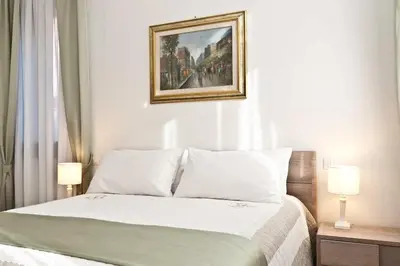 Letto o letti in una camera di Residenza Procuratie Uno