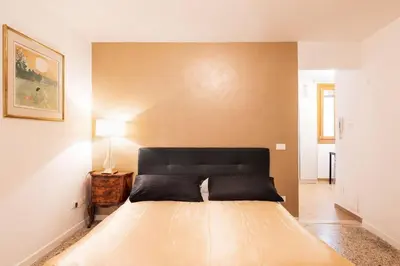Letto o letti in una camera di ANDREA Venice FLAT 1st Floor
