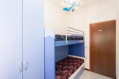 Letto o letti in una camera di Petite Maison