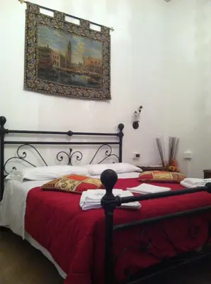 Letto o letti in una camera di B&B Ca' Dor