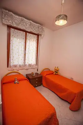 Letto o letti in una camera di Apartments in Rosolina Mare 25071