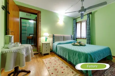 Letto o letti in una camera di Agriturismo Biologico La Buona Terra