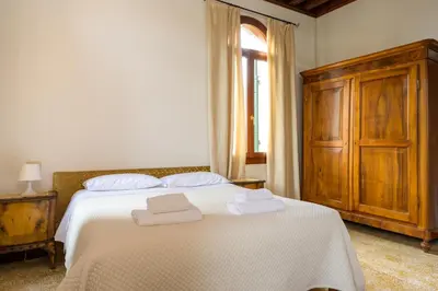 Letto o letti in una camera di Ca' San Trovaso by Sarlux