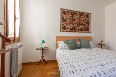 Letto o letti in una camera di Casa Corto M altese