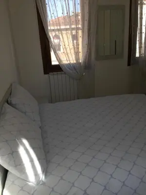 Letto o letti in una camera di Casa Roberta