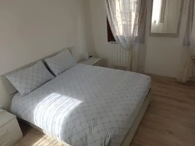 Letto o letti in una camera di Casa Roberta