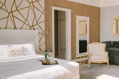 Letto o letti in una camera di iH Hotels Venezia Salute Palace