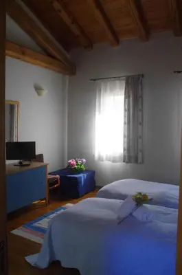 Letto o letti in una camera di Osteria La Pesa