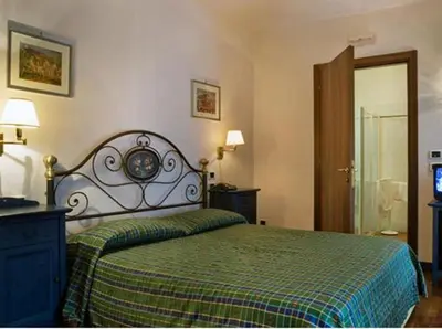 Letto o letti in una camera di Albergo La Bersagliera