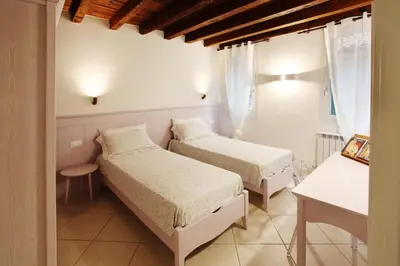 Letto o letti in una camera di Ca' de l'Anzolo