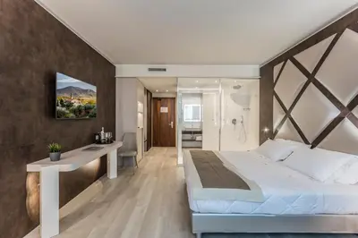 Letto o letti in una camera di Hotel Victoria