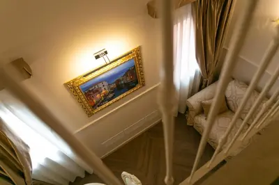 Letto o letti in una camera di Ca' Vittoria Boutique House ApartSuite Chioggia