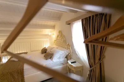 Letto o letti in una camera di Ca' Vittoria Boutique House ApartSuite Chioggia