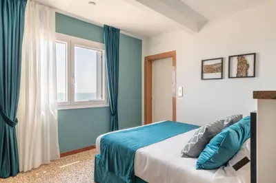 Letto o letti in una camera di Sea Tower Torre Telemetrica Lido di Venezia