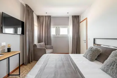 Letto o letti in una camera di Sea Tower Torre Telemetrica Lido di Venezia