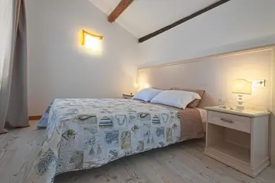 Letto o letti in una camera di Palazzetto Canossa