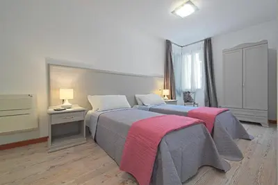 Letto o letti in una camera di Palazzetto Canossa