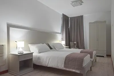 Letto o letti in una camera di Palazzetto Canossa