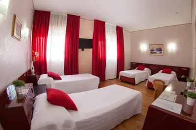 Letto o letti in una camera di Hotel Master