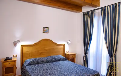 Letto o letti in una camera di Hotel Casanova