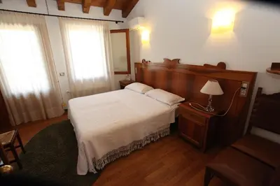 Letto o letti in una camera di Agriturismo MELO IN FIORE con camere e colazioni nella zona del Prosecco DOCG Asolo