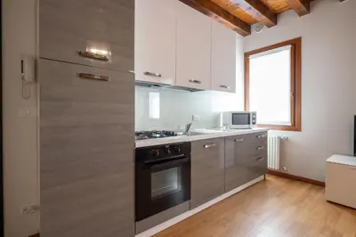 Cucina o angolo cottura di Design Palace Apartment by Wonderful Italy