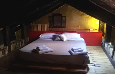 Letto o letti in una camera di Mariangela Art Lodge