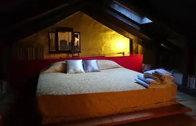 Letto o letti in una camera di Mariangela Art Lodge