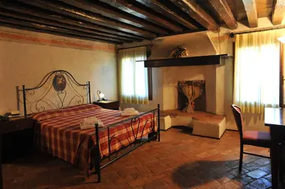 Letto o letti in una camera di Hotel La Corte