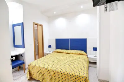 Letto o letti in una camera di Hotel Eraclea