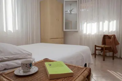 Letto o letti in una camera di Appartamenti Giardino al Mare