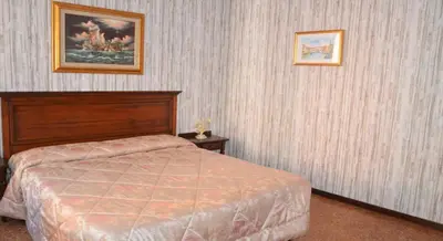 Letto o letti in una camera di Best Holidays Venice