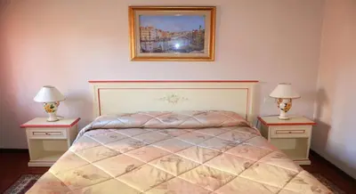 Letto o letti in una camera di Best Holidays Venice