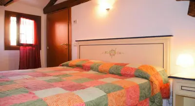 Letto o letti in una camera di Best Holidays Venice