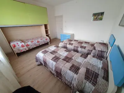 Letto o letti in una camera di Meneghin House