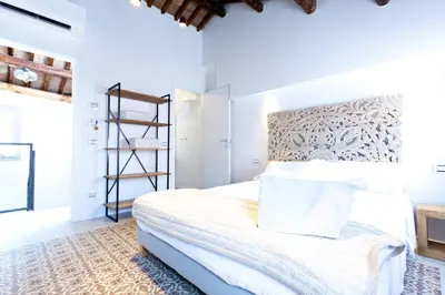 Letto o letti in una camera di B&B LA CANEVA 951