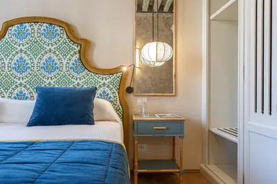 Letto o letti in una camera di La Dimora di San Maurizio 2- Dimora Italia -