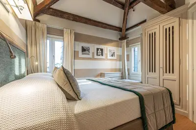 Letto o letti in una camera di La Dimora di San Maurizio 4 Terrace - Dimora Italia -