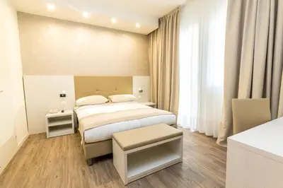Letto o letti in una camera di Hotel Touring