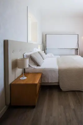 Letto o letti in una camera di Hotel Touring