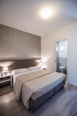 Letto o letti in una camera di Hotel Touring