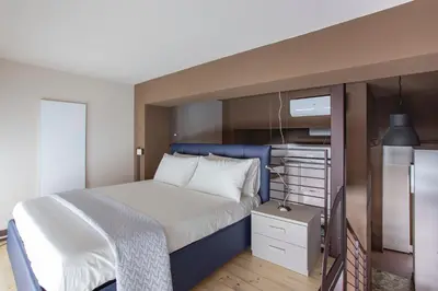 Letto o letti in una camera di Madonna Granda Loft by Welc(H)ome