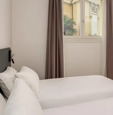 Letto o letti in una camera di Hotel Canton dell'Orto