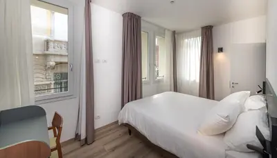 Letto o letti in una camera di Hotel Canton dell'Orto