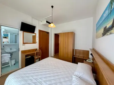 Letto o letti in una camera di Hotel Palme