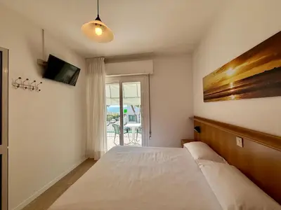 Letto o letti in una camera di Hotel Palme