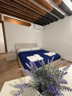 Letto o letti in una camera di Appartamento treVi