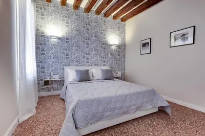 Letto o letti in una camera di Rugabella Rialto Deluxe by Wonderful Italy