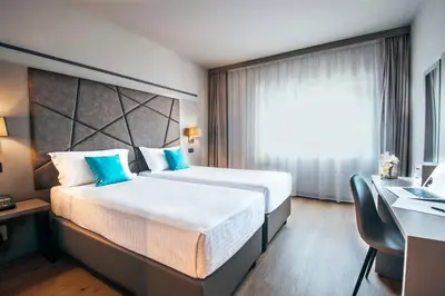 Letto o letti in una camera di DC HOTEL INTERNATIONAL